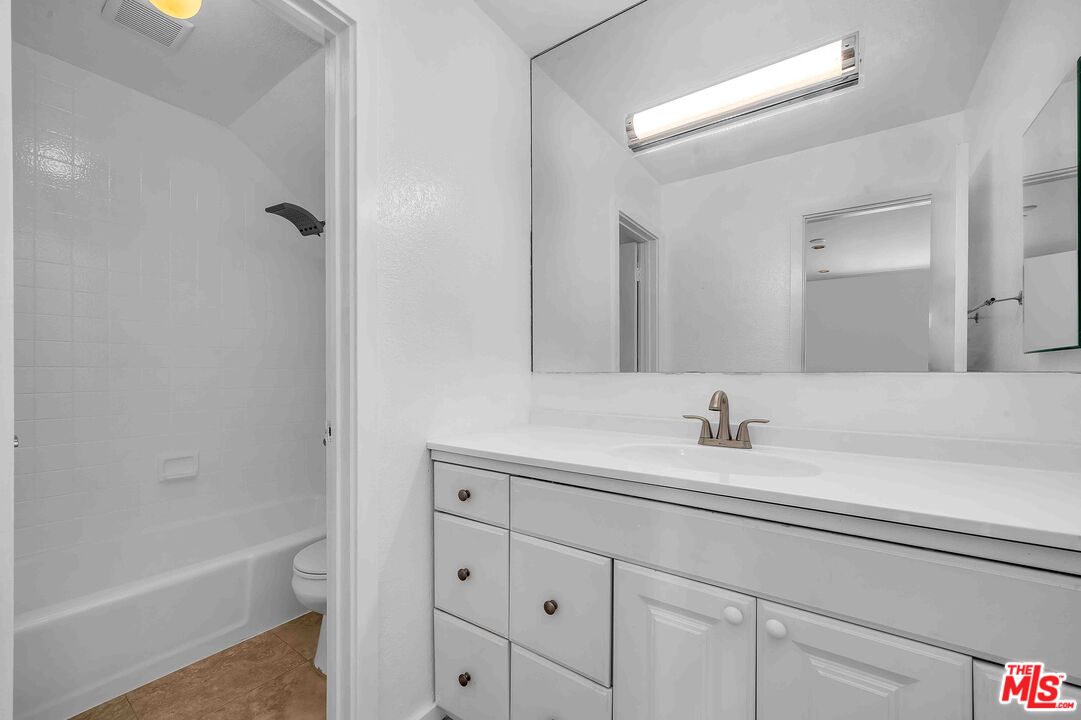 15 63rd Avenue, Unit 3 Playa del Rey, CA 90293 - Photo 29 of 34 a bathroom with a sink a toilet and a tub