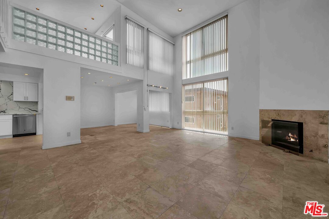 15 63rd Avenue, Unit 3 Playa del Rey, CA 90293 - Photo 4 of 34 a view of an empty room with a fireplace