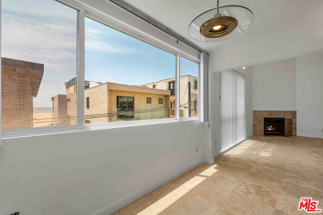 15 63rd Avenue, Unit 3 Playa del Rey, CA 90293 - Photo 6 of 34 a view of a living room with furniture and a fireplace