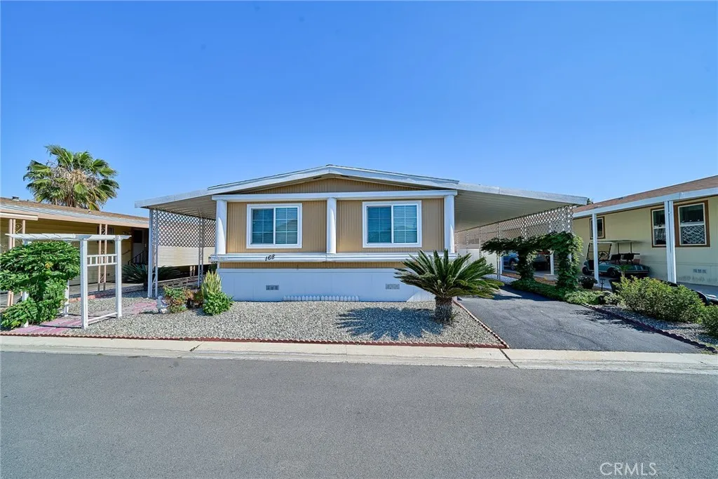 4000 Pierce Street, Unit 168 Riverside, CA 92505 - Photo 2 of 34 front view of a house with a street
