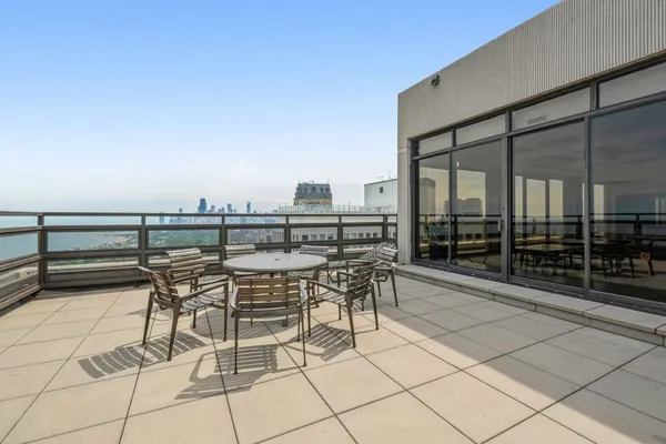 a view of a terrace with chairs
