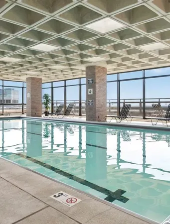 a swimming pool with outdoor seating
