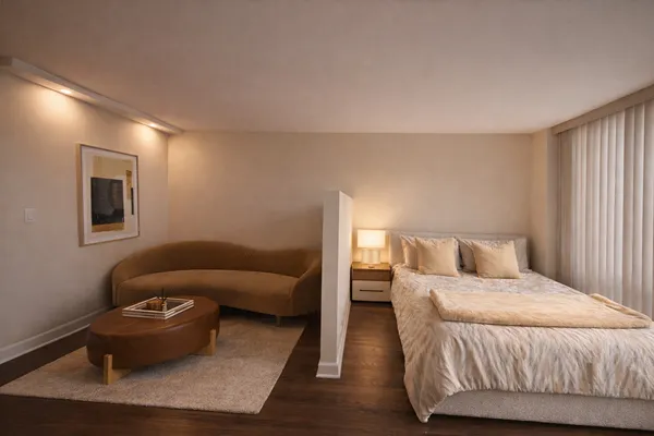 a bedroom with a bed and a couch