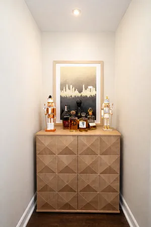 a room with a mirror and vanity