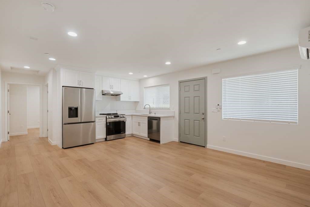 1806 South 8th Street, Unit B Alhambra, CA 91803 - Photo 17 of 44 a large kitchen with stainless steel appliances kitchen island a large counter top and a stove top oven