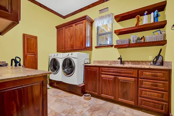 a utility room with dryer and washer