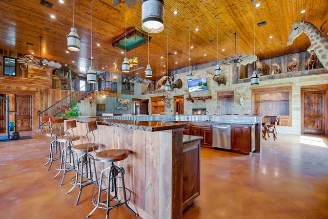 a view of a chairs and table in a patio
