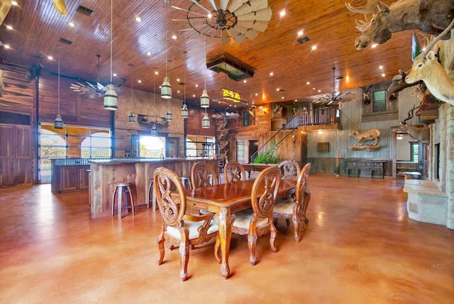a dining space with furniture and a kitchen view