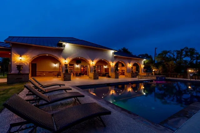 a room with furniture a lamp and a fireplace