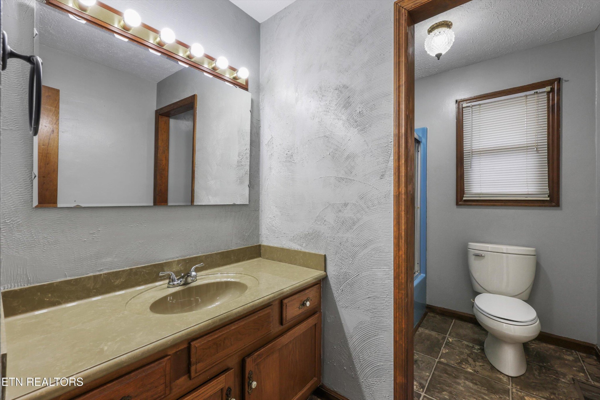 47 Paint Rock Ferry Road Kingston, TN 37763 - Photo 10 of 38 a bathroom with a toilet sink and mirror