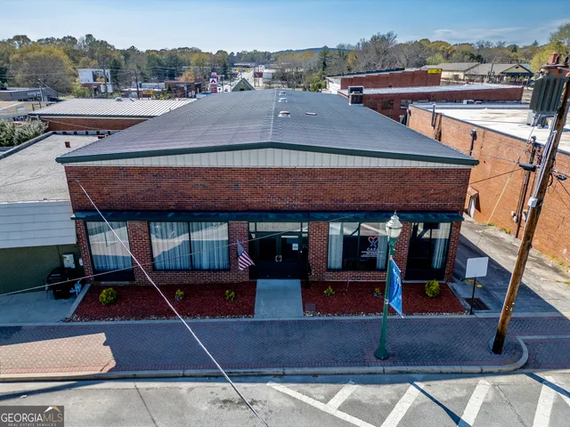 an aerial view of a house with basket ball court