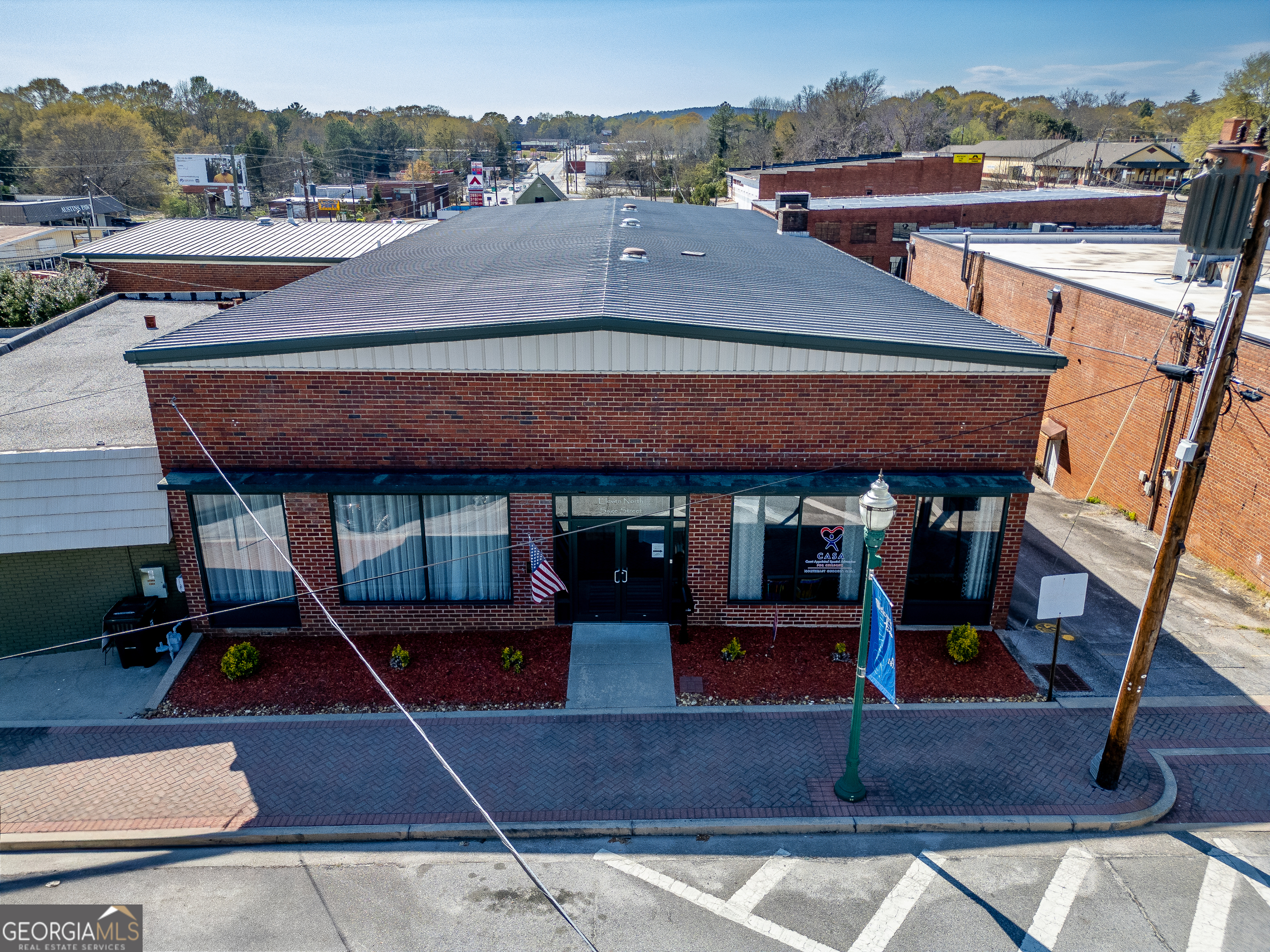 an aerial view of a house with basket ball court