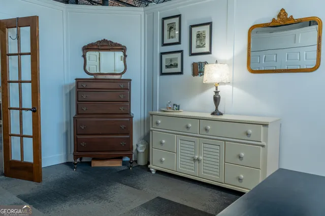 a bathroom with a sink mirror and toilet