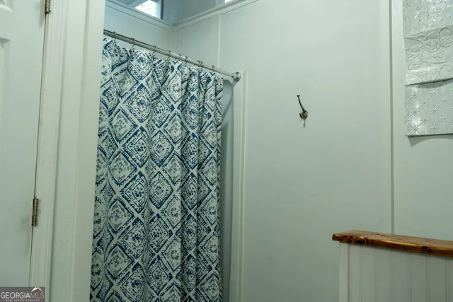 a view of a kitchen area with furniture and wooden floor