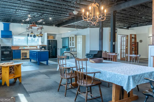 a living room with furniture and a book shelf