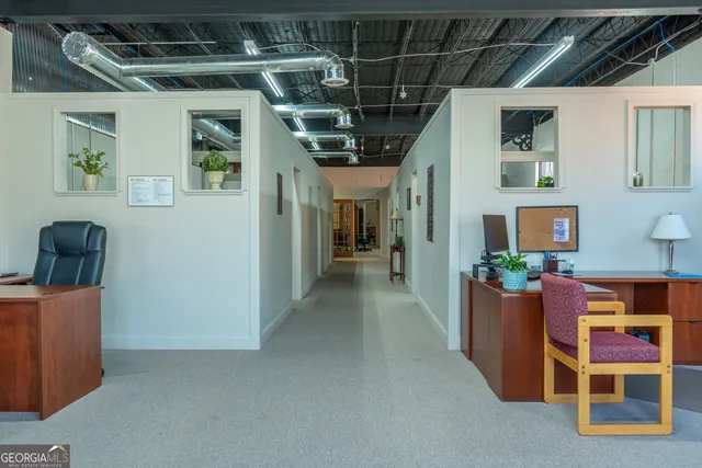 a room with furniture and pool table