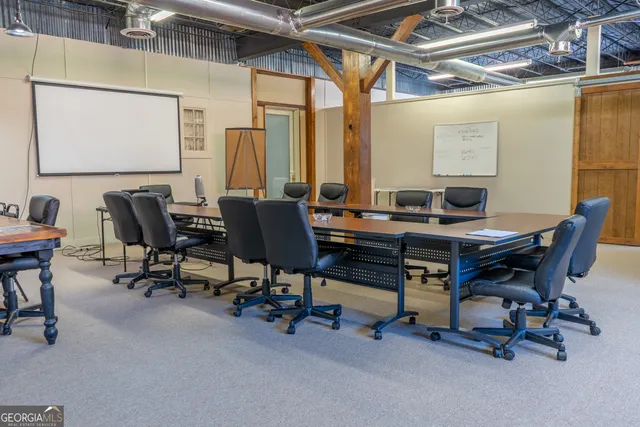a view of storage and utility room with two washing machine