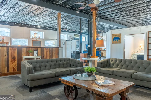 a view of a hallway with seating area