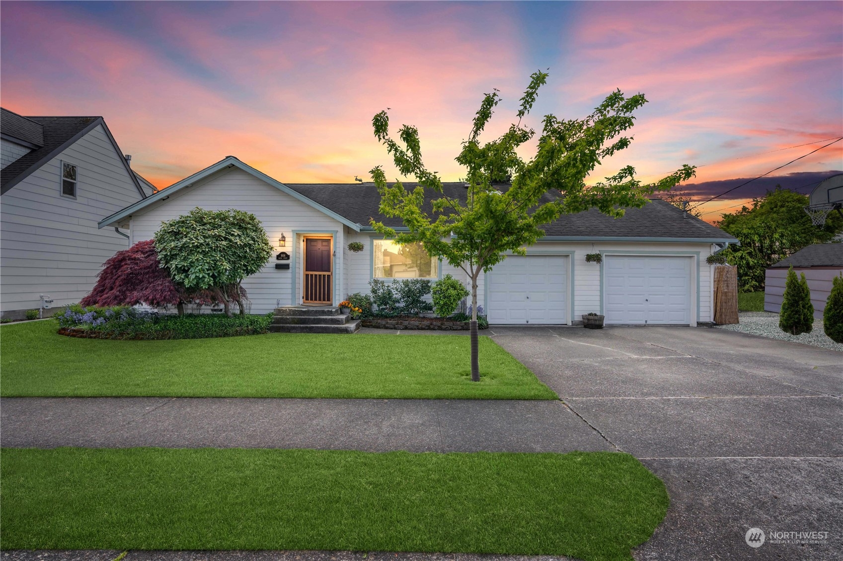 1616 Maple Street Sumner, WA 98390 - Photo 1 of 40 a front view of a house with a yard and garage