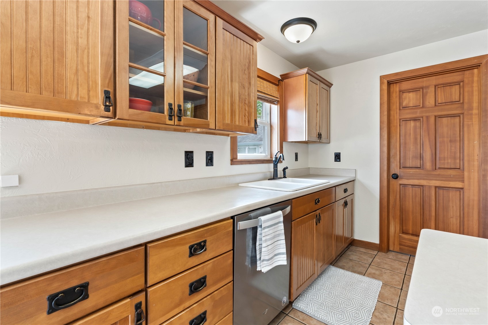 1616 Maple Street Sumner, WA 98390 - Photo 12 of 40 a kitchen with stainless steel appliances granite countertop a sink and cabinets