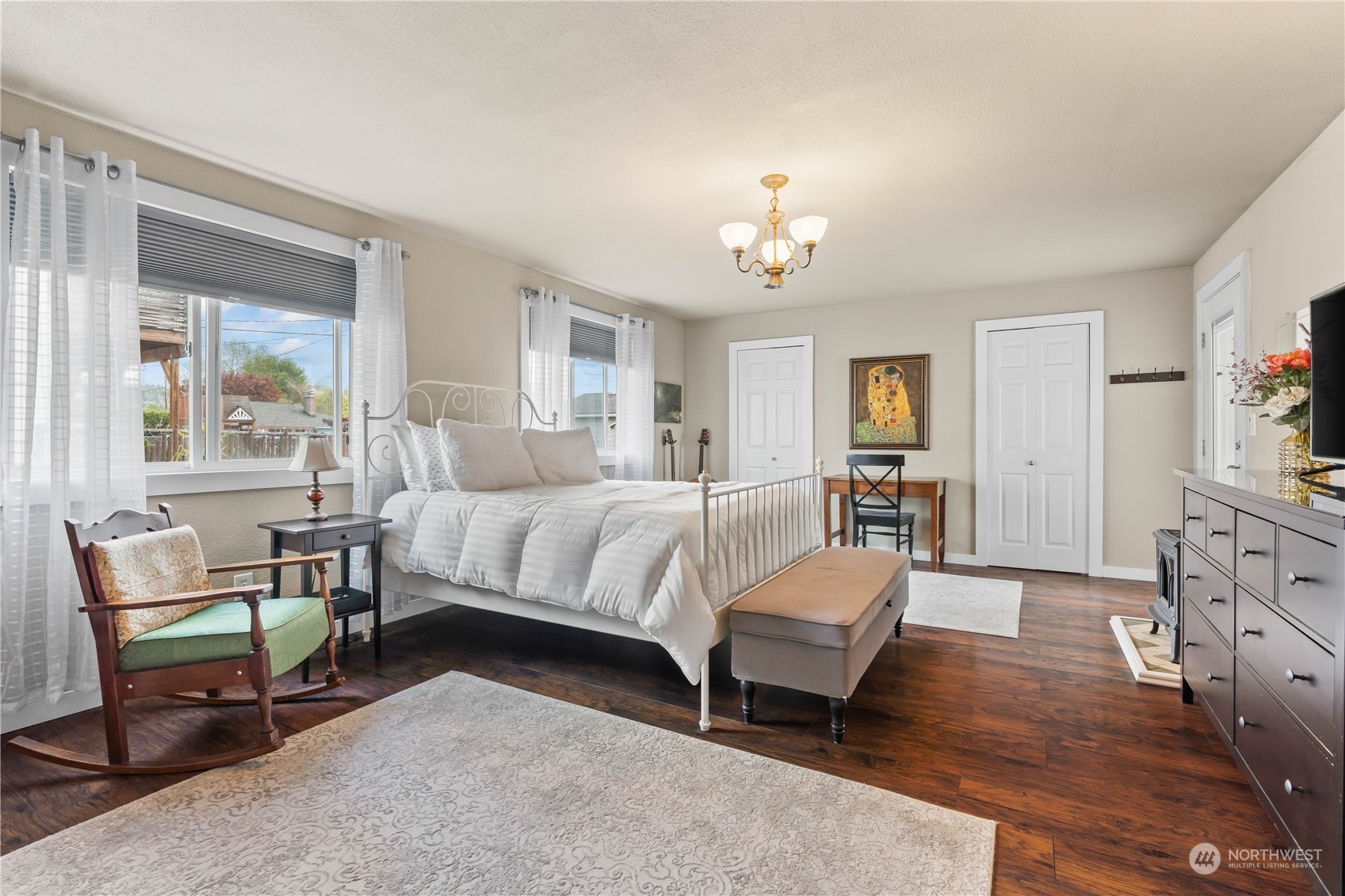 1616 Maple Street Sumner, WA 98390 - Photo 15 of 40 a bedroom with a bed chairs and windows