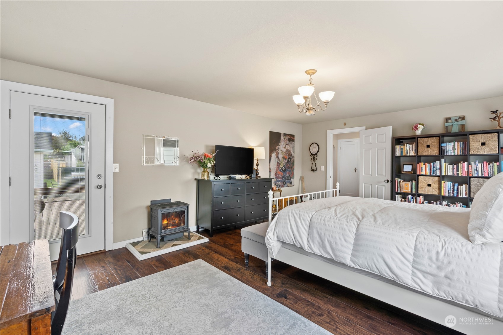 1616 Maple Street Sumner, WA 98390 - Photo 16 of 40 a spacious bedroom with a bed window and a couch