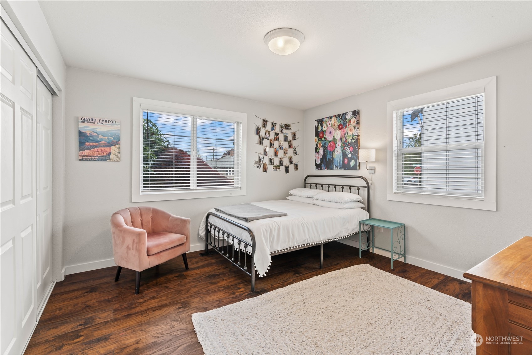 1616 Maple Street Sumner, WA 98390 - Photo 17 of 40 a bedroom with a bed couch and a window