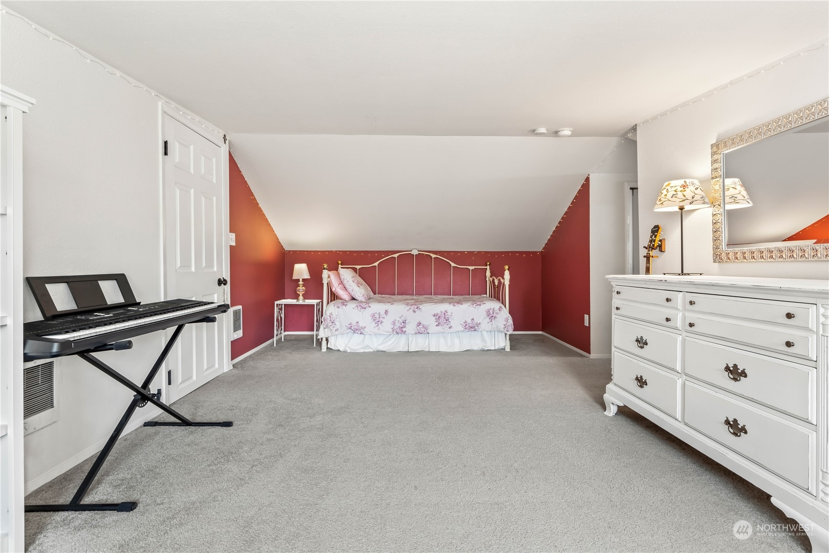 1616 Maple Street Sumner, WA 98390 - Photo 19 of 40 a spacious bedroom with a bed and a dresser in it