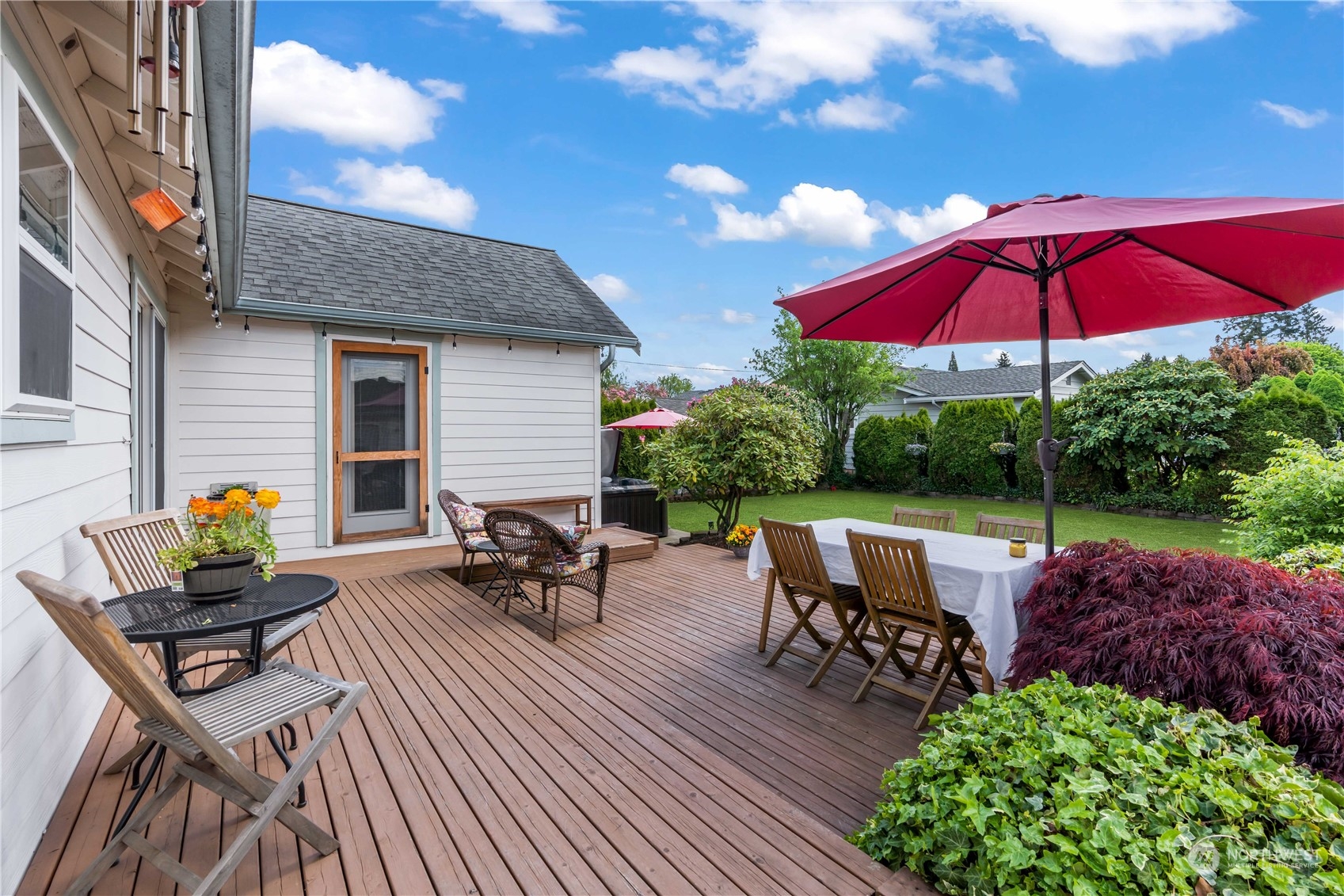 1616 Maple Street Sumner, WA 98390 - Photo 22 of 40 a view of a backyard with sitting area and furniture