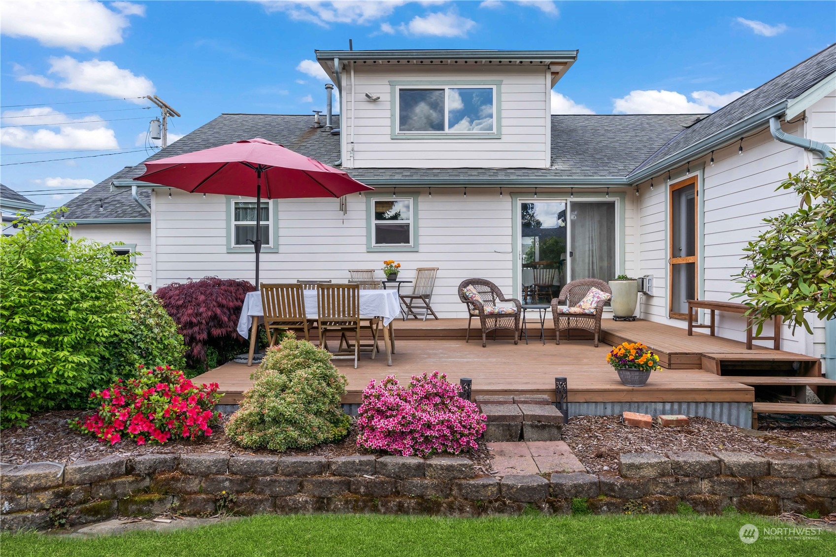 1616 Maple Street Sumner, WA 98390 - Photo 25 of 40 a view of a house with yard and sitting area