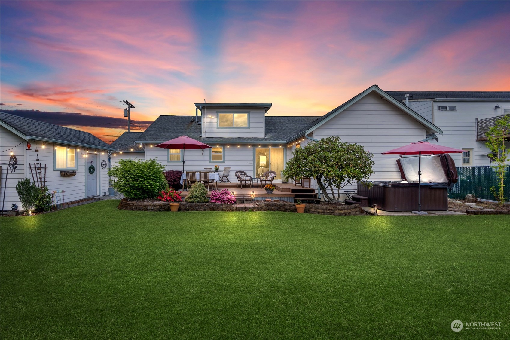 1616 Maple Street Sumner, WA 98390 - Photo 26 of 40 a front view of a house with garden