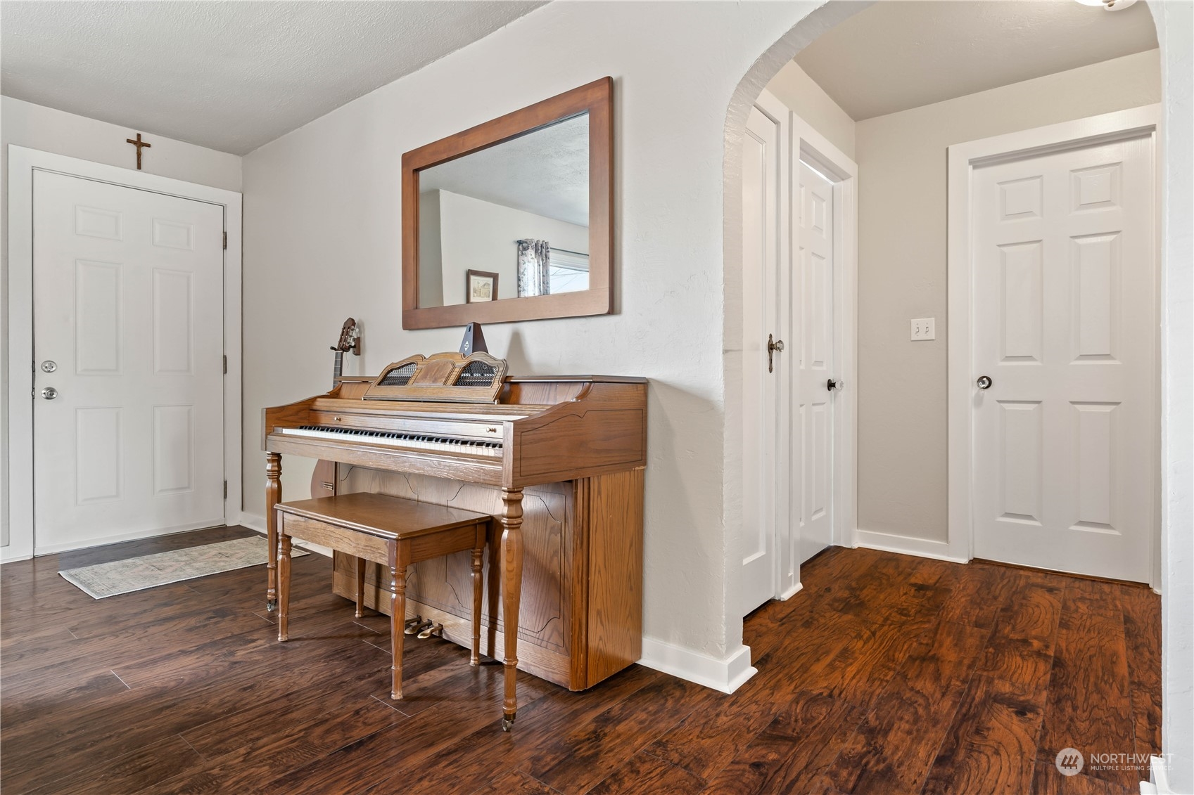 1616 Maple Street Sumner, WA 98390 - Photo 3 of 40 a bedroom with a bed and a table in it