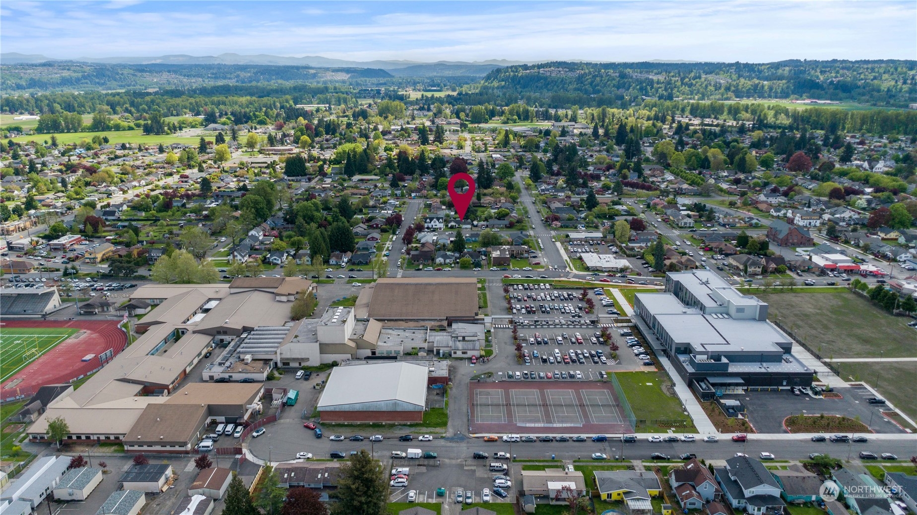 1616 Maple Street Sumner, WA 98390 - Photo 34 of 40 an aerial view of a city with lots of residential buildings