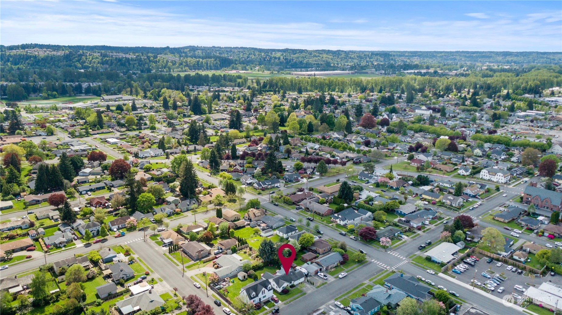 1616 Maple Street Sumner, WA 98390 - Photo 36 of 40 an aerial view of a city with lots of residential buildings