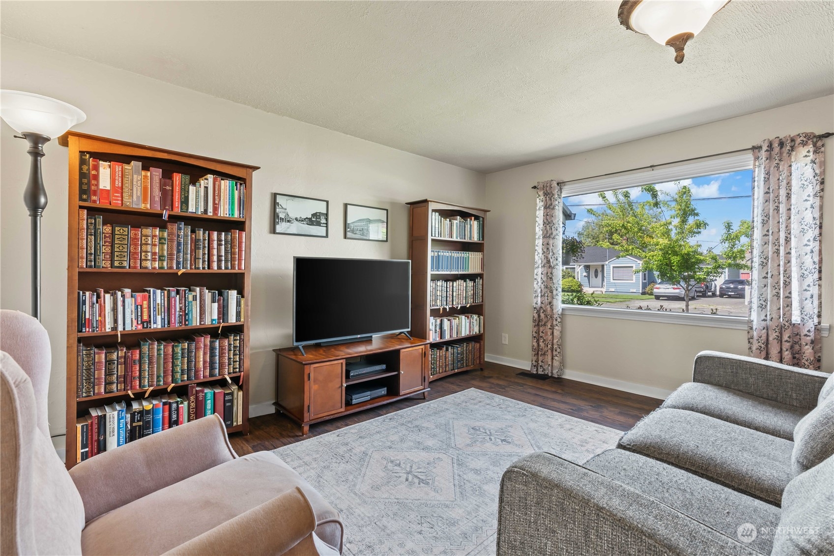 1616 Maple Street Sumner, WA 98390 - Photo 5 of 40 a living room with furniture and a flat screen tv