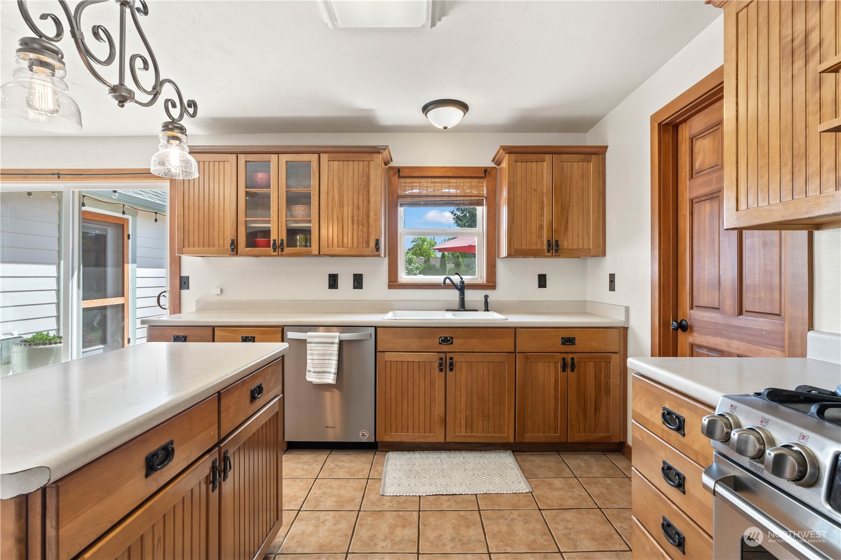 1616 Maple Street Sumner, WA 98390 - Photo 9 of 40 a kitchen with a sink stove top oven and cabinets