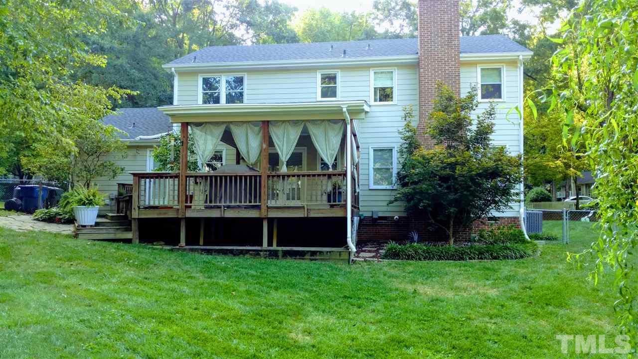 5517 Mapleridge Road Raleigh, NC 27609 - Photo 2 of 17 a view of house with a big yard and large trees