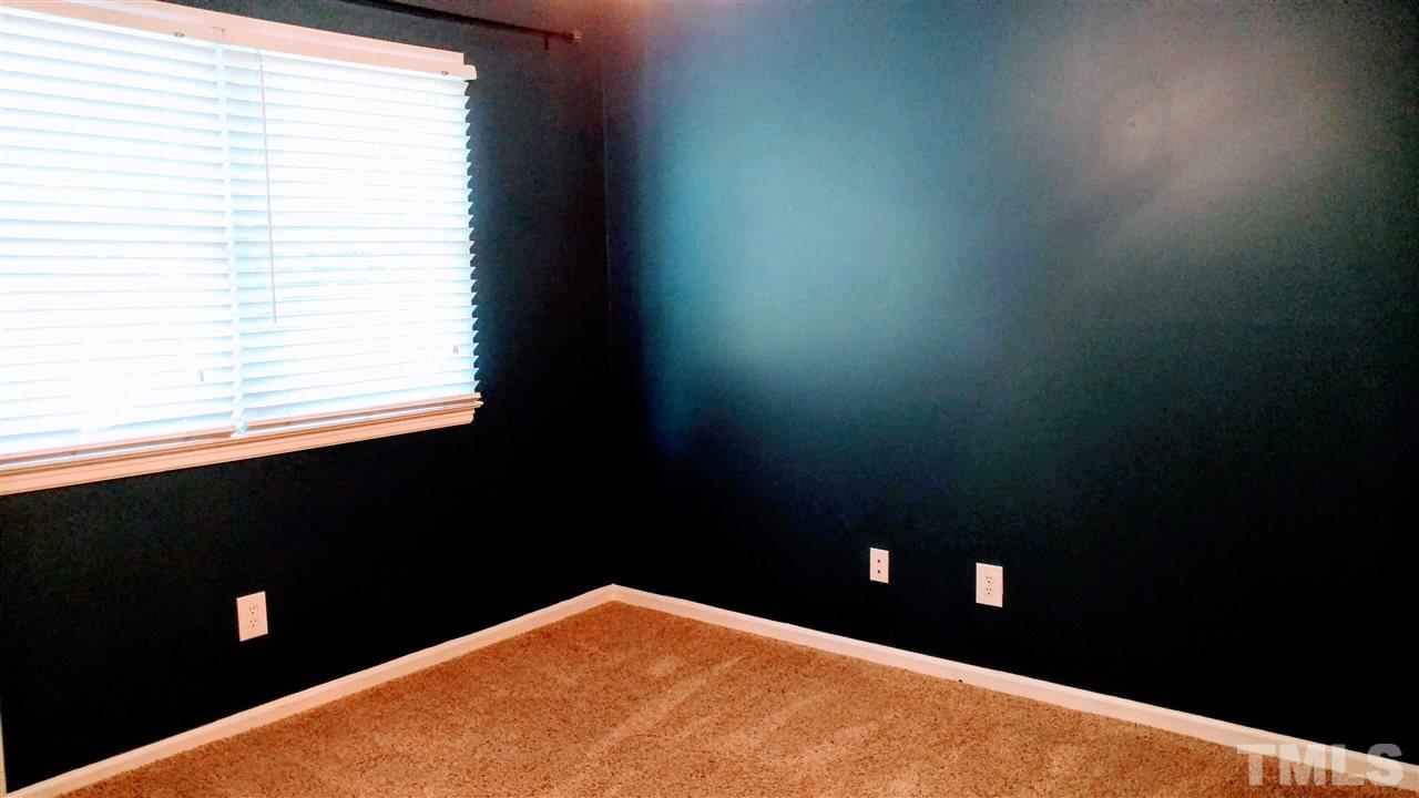 5517 Mapleridge Road Raleigh, NC 27609 - Photo 12 of 17 a view of an empty room and window