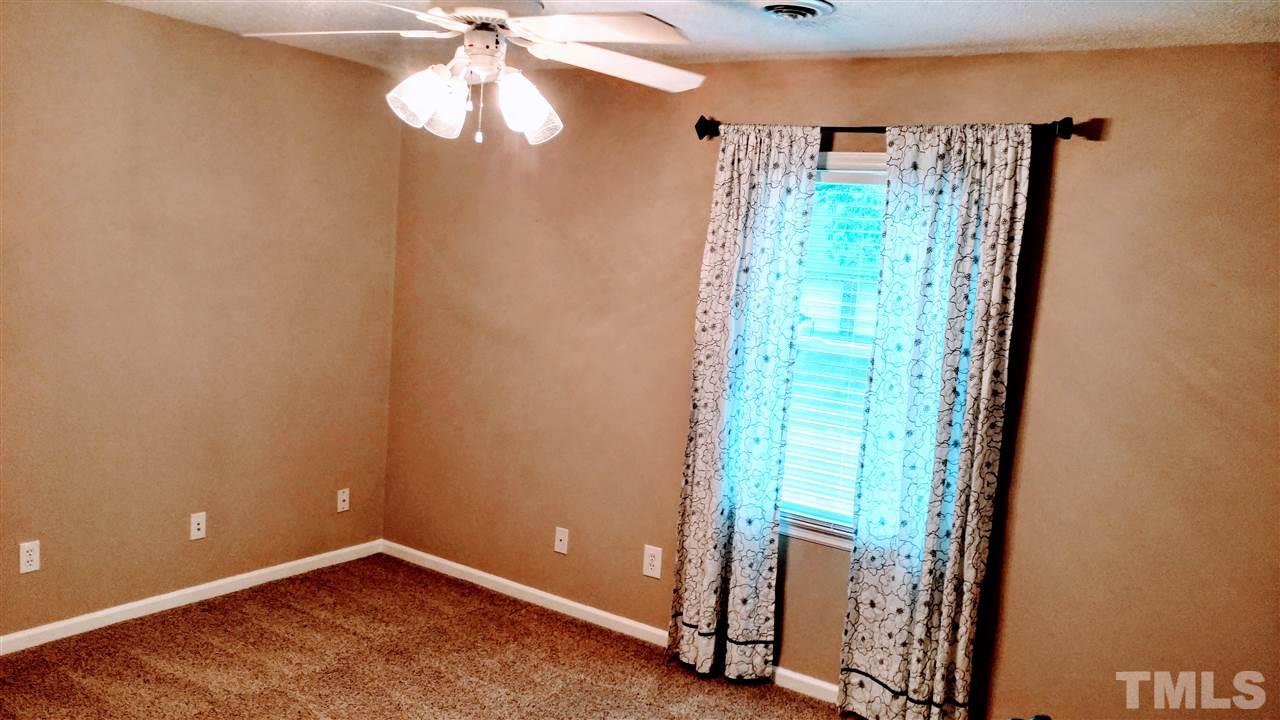 5517 Mapleridge Road Raleigh, NC 27609 - Photo 13 of 17 a view of an empty room with a window