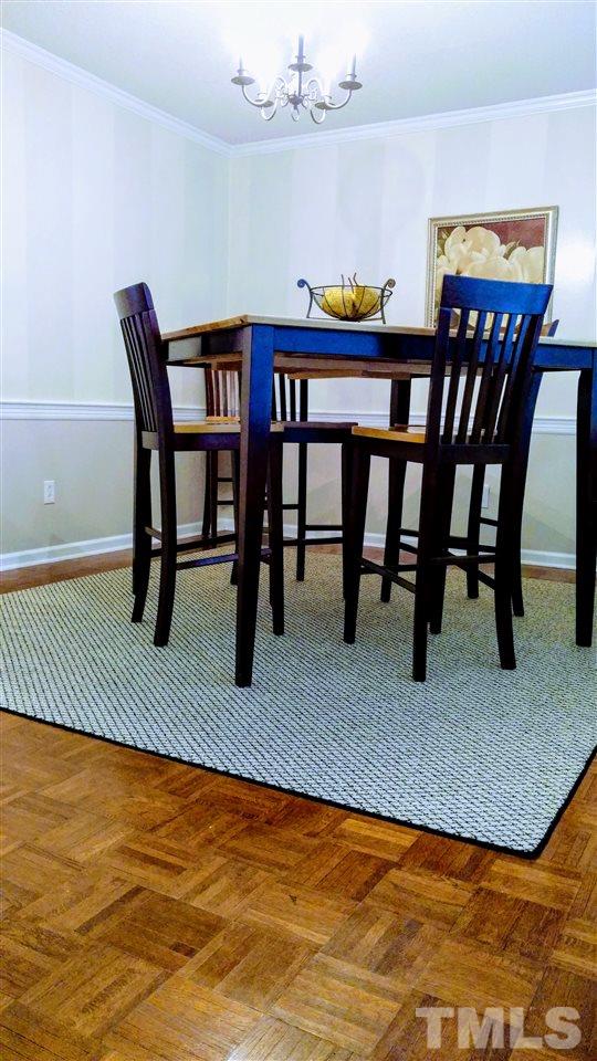 5517 Mapleridge Road Raleigh, NC 27609 - Photo 6 of 17 a view of a dining room with furniture