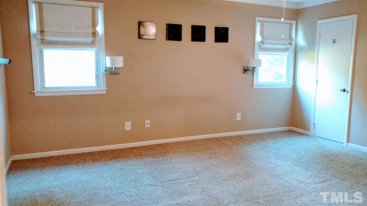 5517 Mapleridge Road Raleigh, NC 27609 - Photo 10 of 17 an empty room with windows