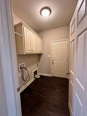 a view of a storage & utility room with wooden floor