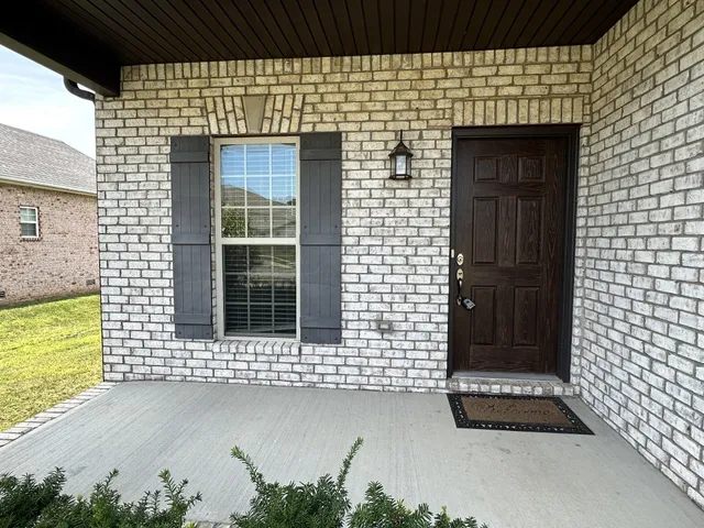 a front view of a house with a glass door