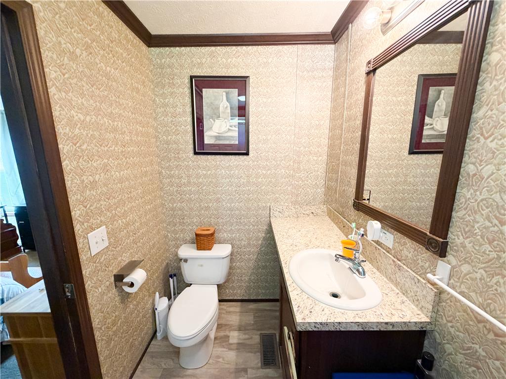 49 Ritz Craft Street Walnutport, PA 18088 - Photo 11 of 17 Functional bathroom featuring a vanity with a sleek countertop and a modern toilet.