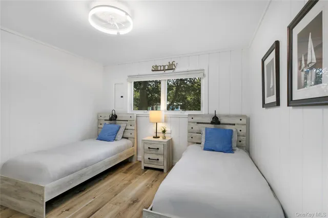 a bedroom with furniture and window