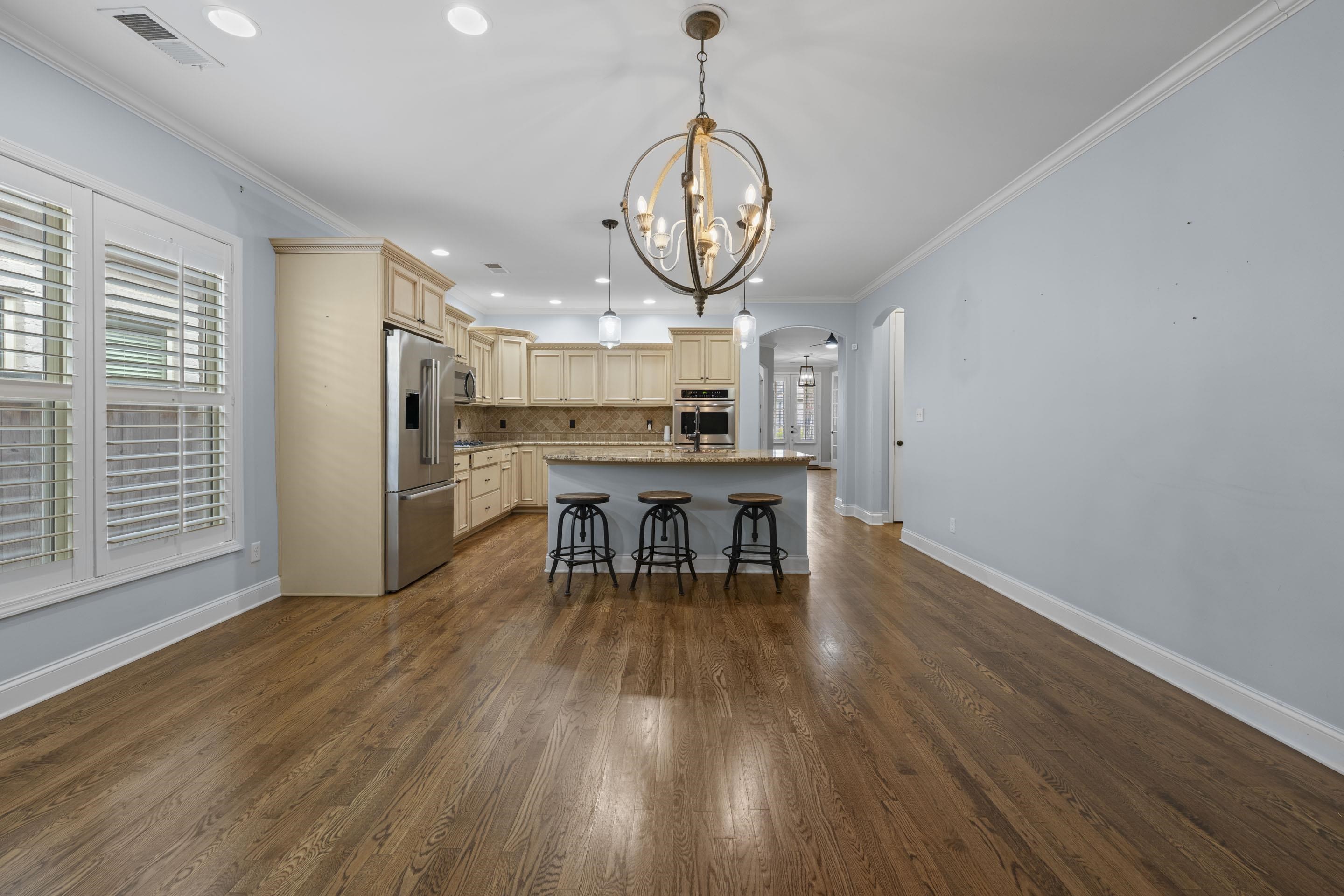 389 South Tarren Mill Circle Collierville, TN 38017 - Photo 15 of 32 a view of a dining room with furniture window and wooden floor
