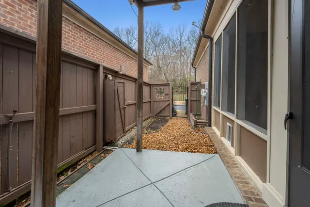 a view of backyard from wooden door