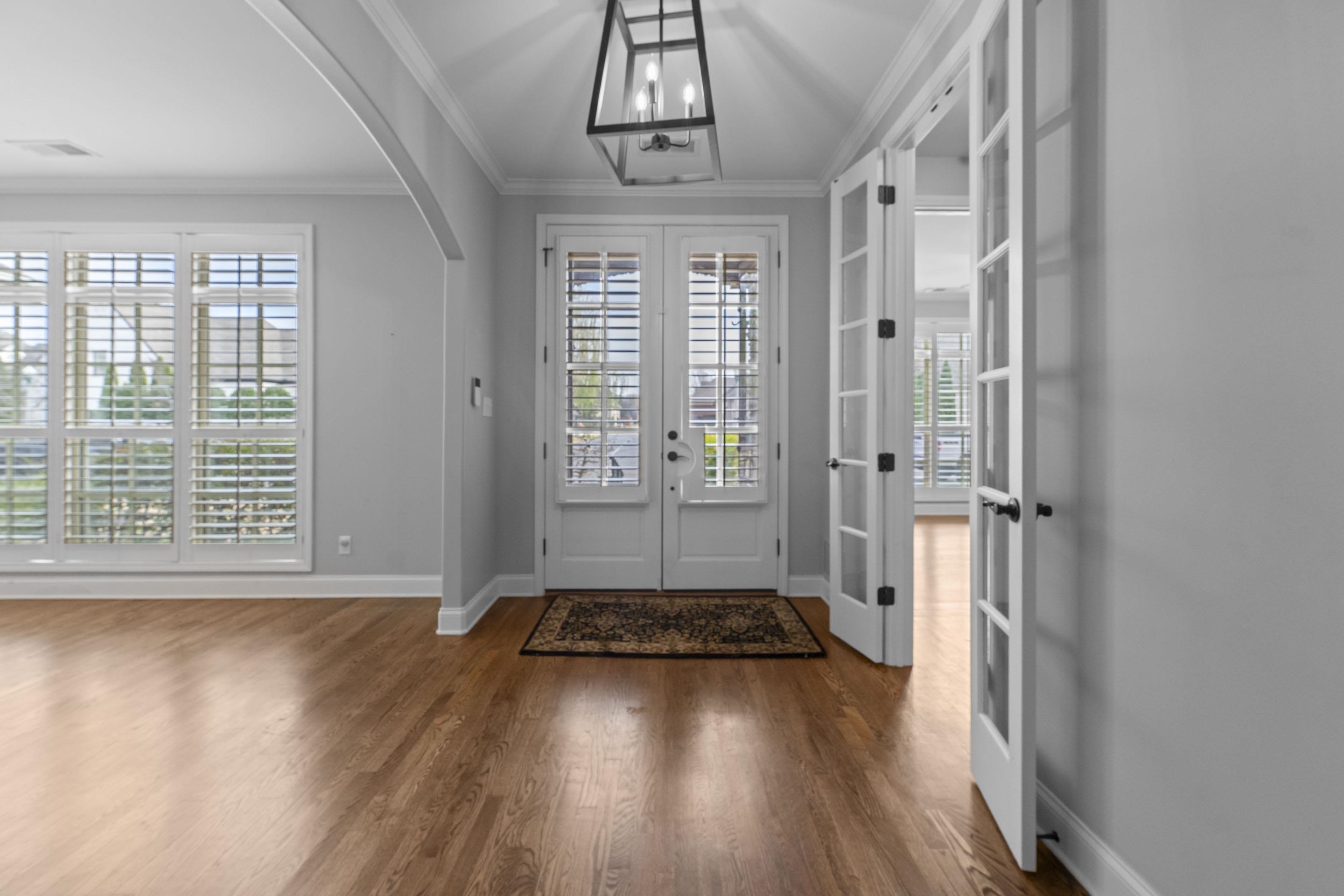 389 South Tarren Mill Circle Collierville, TN 38017 - Photo 5 of 32 wooden floor in an empty room with a window