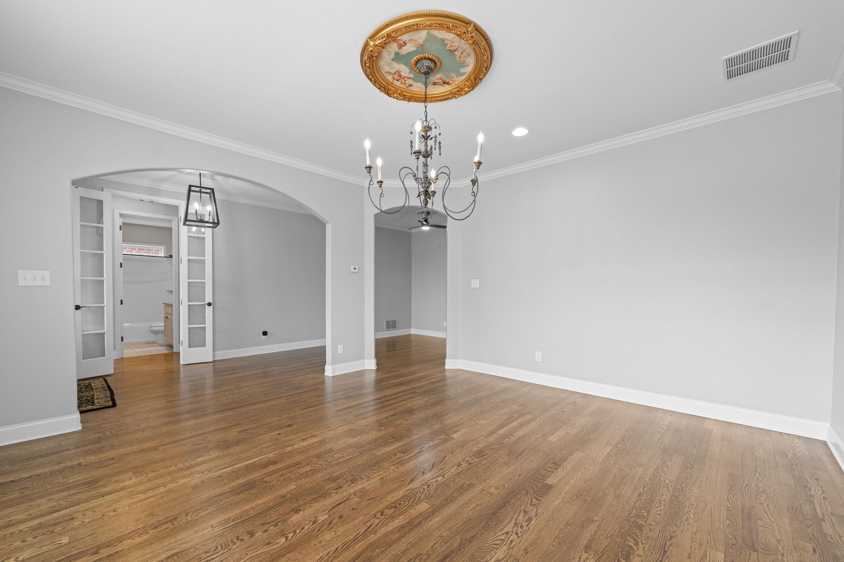 389 South Tarren Mill Circle Collierville, TN 38017 - Photo 8 of 32 a view of a room with wooden floor and chandelier