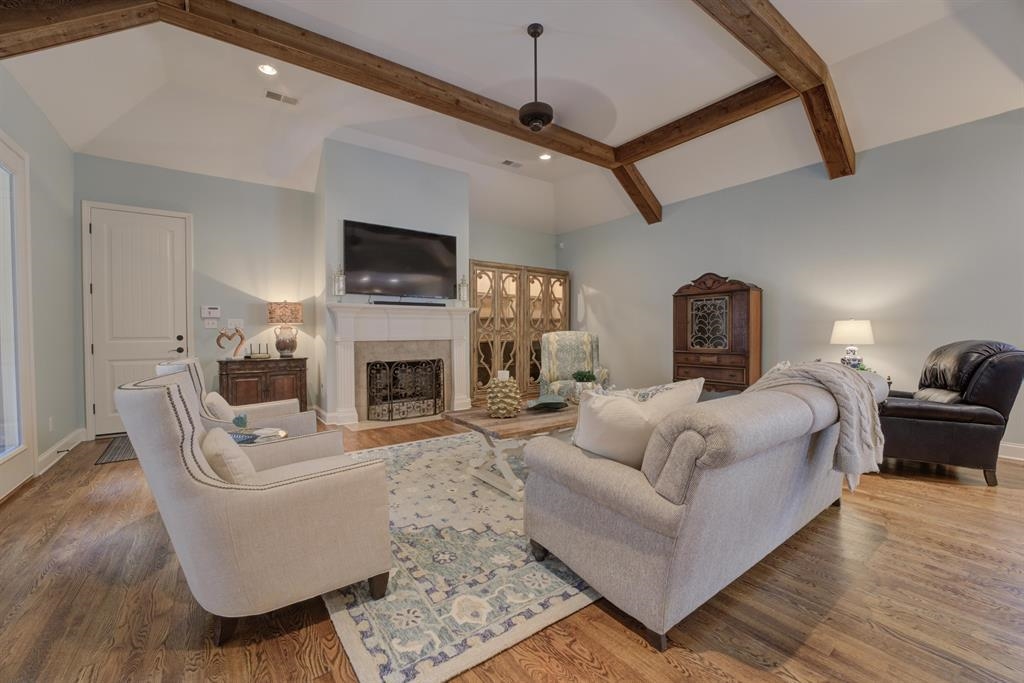389 South Tarren Mill Circle Collierville, TN 38017 - Photo 9 of 32 a living room with furniture a flat screen tv and a fireplace